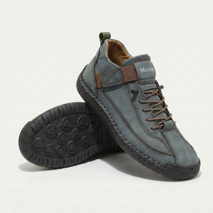 High-top lace-up sneakers with elastic ankle straps and textured flat soles
