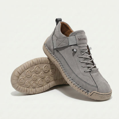 High-top lace-up sneakers with elastic ankle straps and textured flat soles