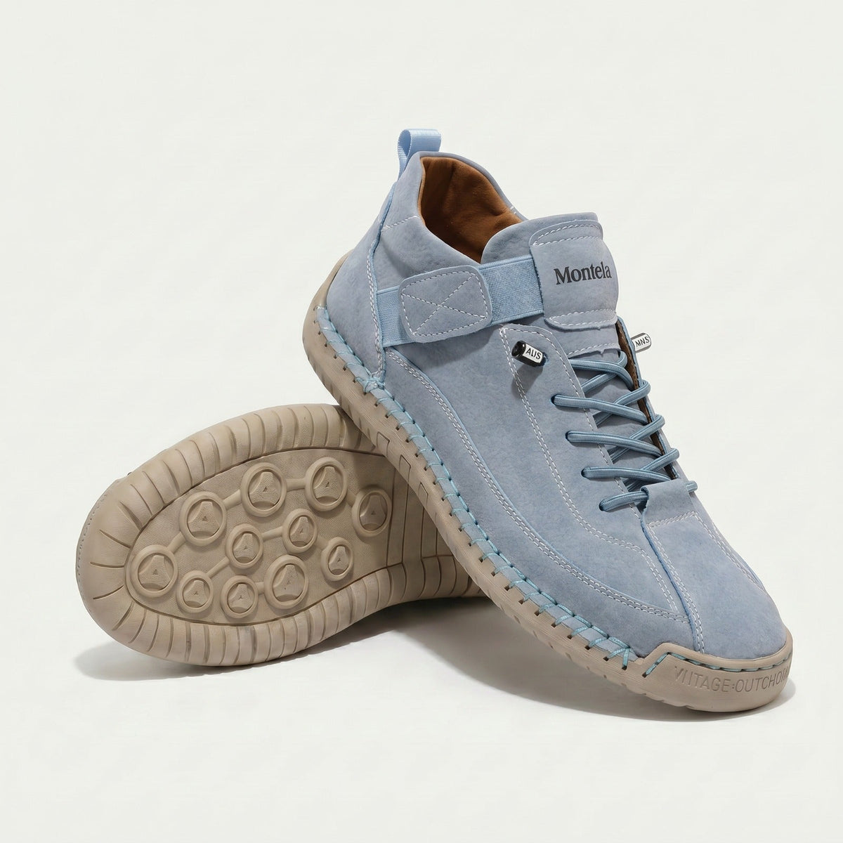 High-top lace-up sneakers with elastic ankle straps and textured flat soles