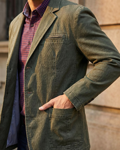 Washed blazer with notched lapels, button front, long sleeves and patch pockets