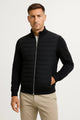 Men's hybrid jacket with quilted front, knitted sleeves and stand collar