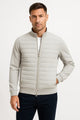 Men's hybrid jacket with quilted front, knitted sleeves and stand collar