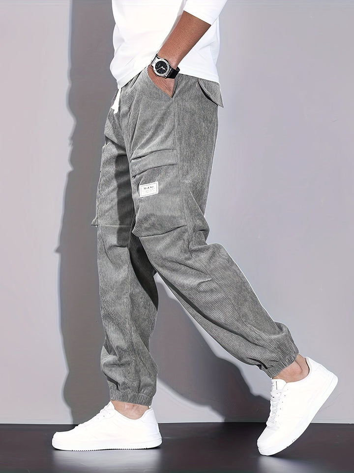 Men's corduroy cargo trousers with tapered legs and elasticated cuffs