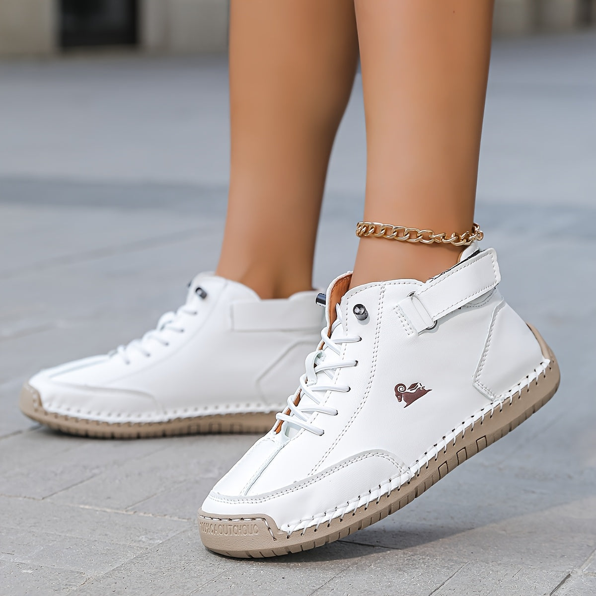 Ankle high lace-up sneakers with stitched panels, ankle strap and contrast sole