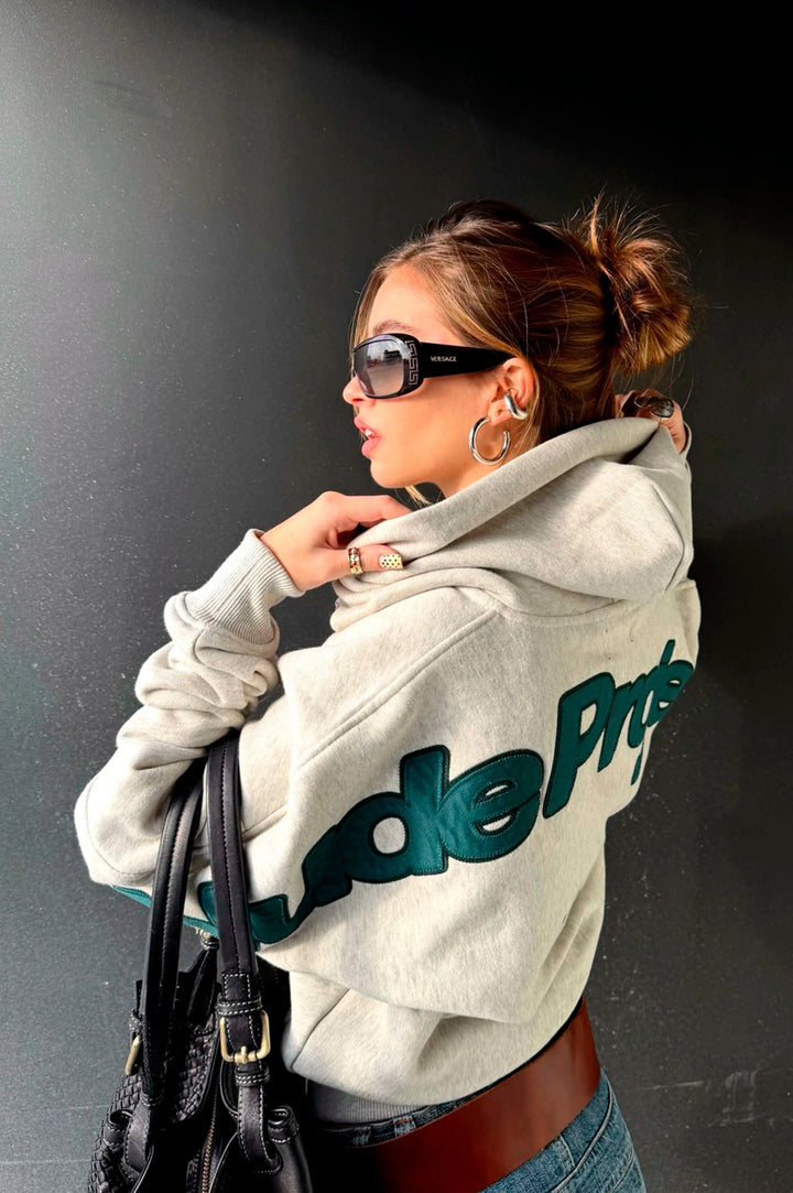 Grey graphic zip-up hoodie with hood and lettering