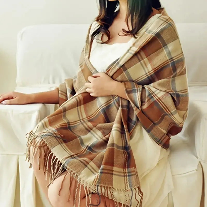 Oversized fringed wrap scarf shown draped around the shoulders and neck