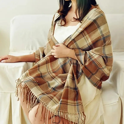 Oversized fringed wrap scarf shown draped around the shoulders and neck