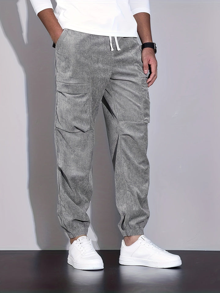 Men's corduroy cargo trousers with tapered legs and elasticated cuffs