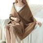 Oversized fringed wrap scarf shown draped around the shoulders and neck