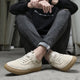 Men's low-top lace-up sneakers with textured soles