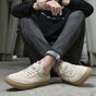 Men's low-top lace-up sneakers with textured soles