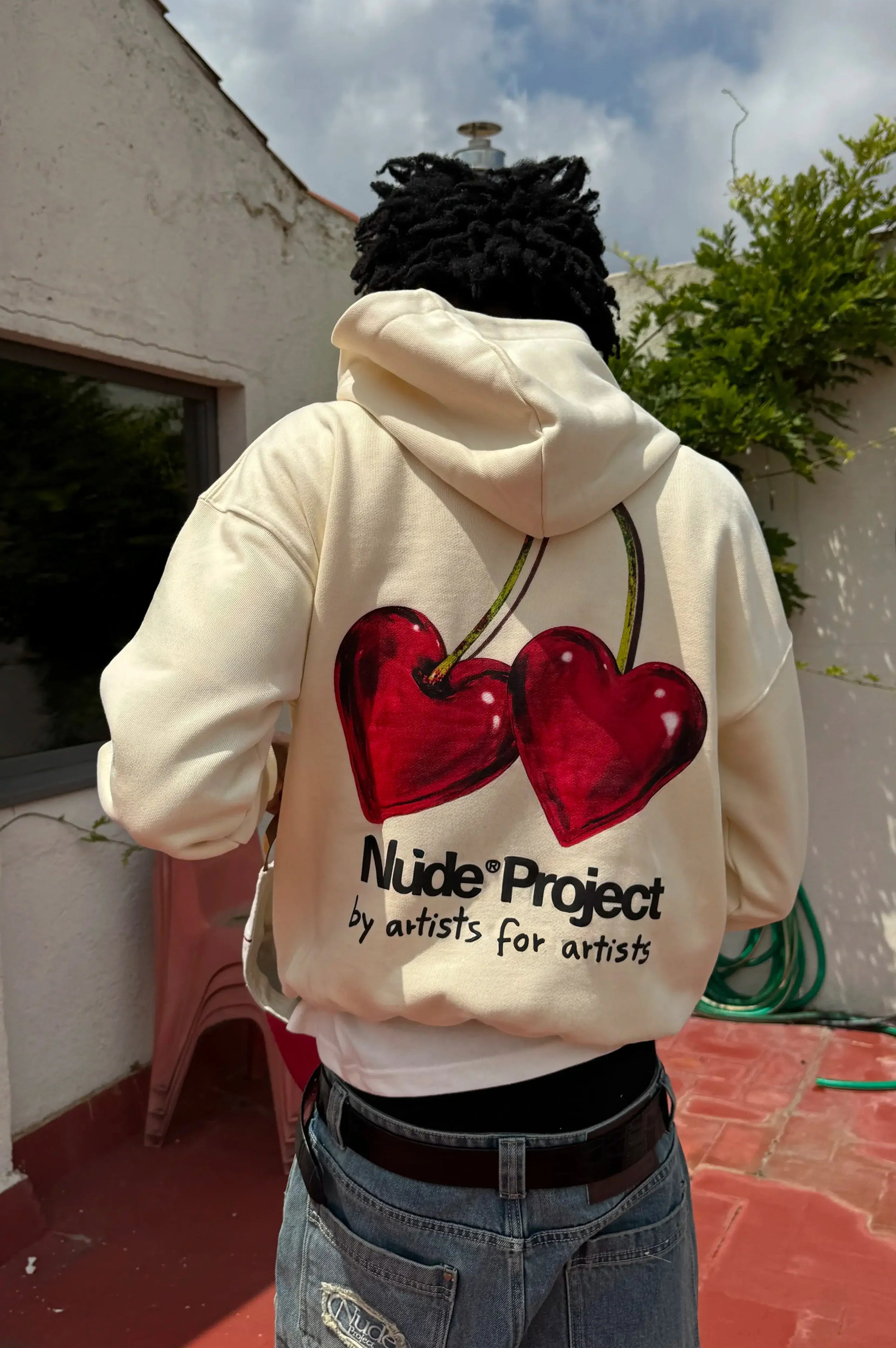 Ivory hoodie with red cherry graphic and hood