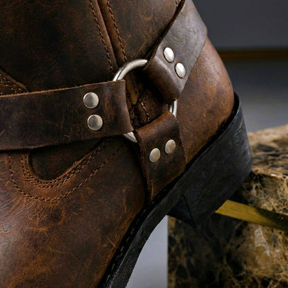 Tall biker boots with buckle straps, side zip and low block heel