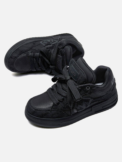 Black high-top sneakers with laces, camouflage side detail and rubber soles