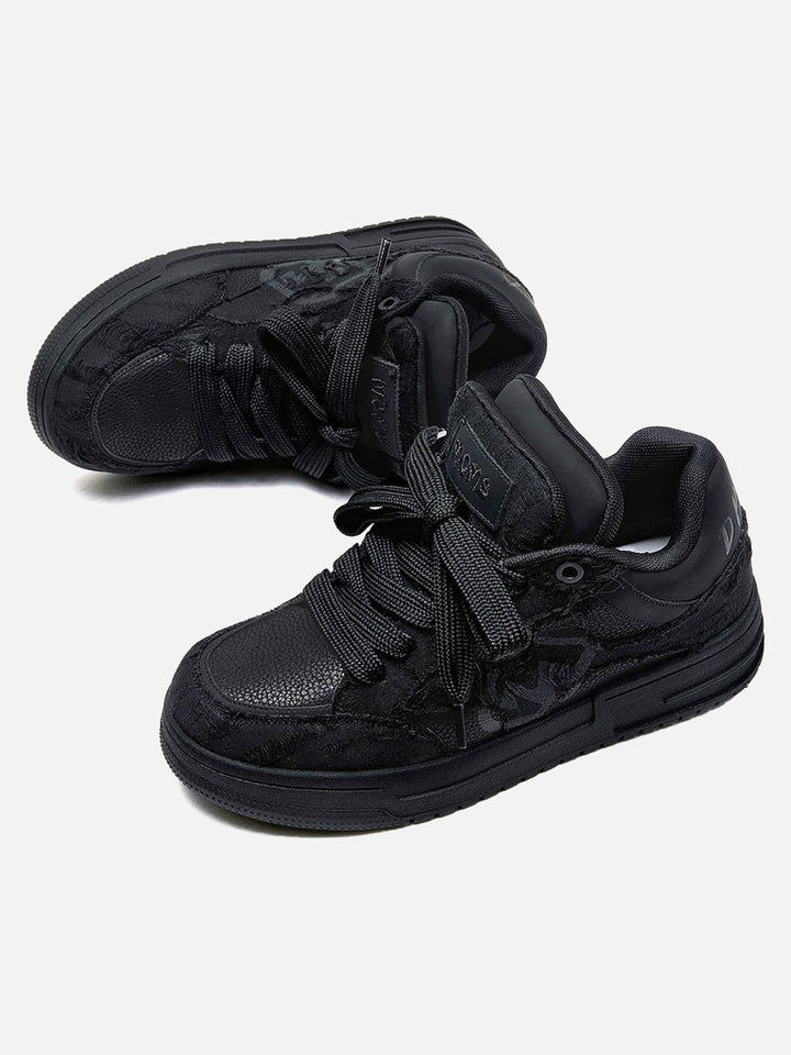 Black high-top sneakers with laces, camouflage side detail and rubber soles