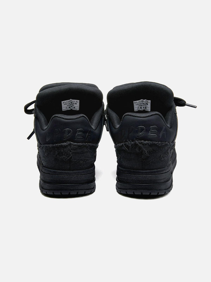 Black high-top sneakers with laces, camouflage side detail and rubber soles