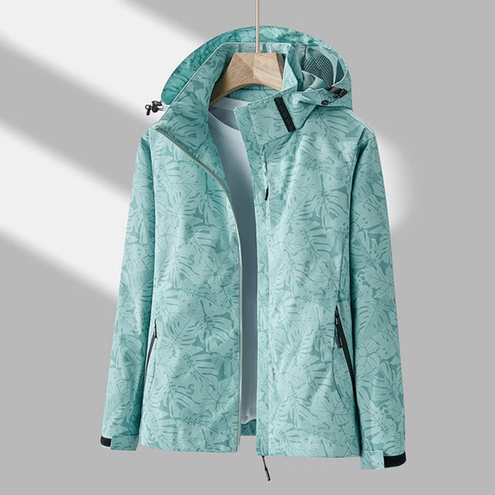 Women's leaf print hooded jacket with zip front and side pockets
