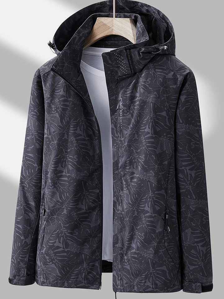 Women's leaf print hooded jacket with zip front and side pockets