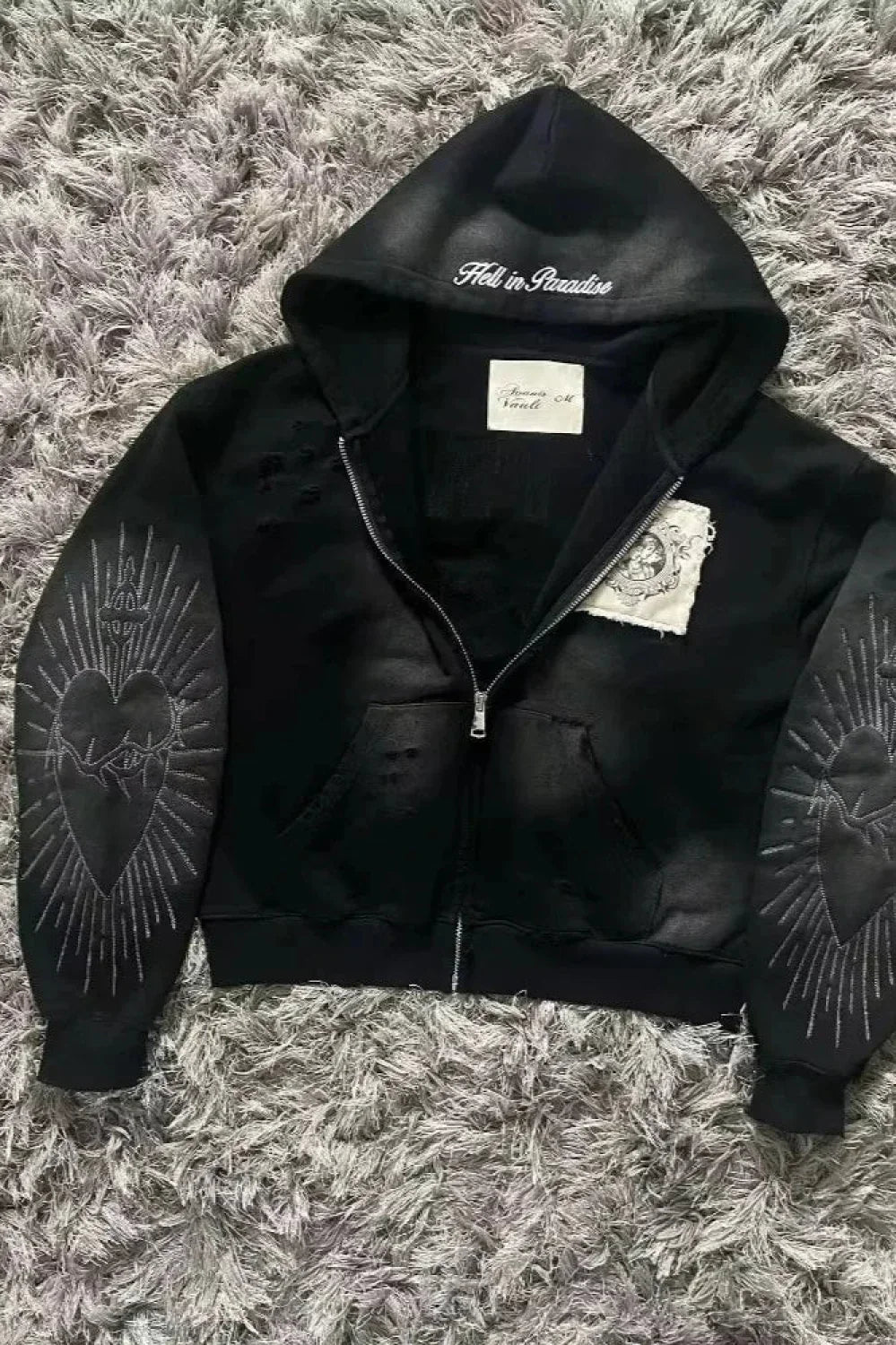 Unisex padded zip hoodie with attached hood and long sleeves