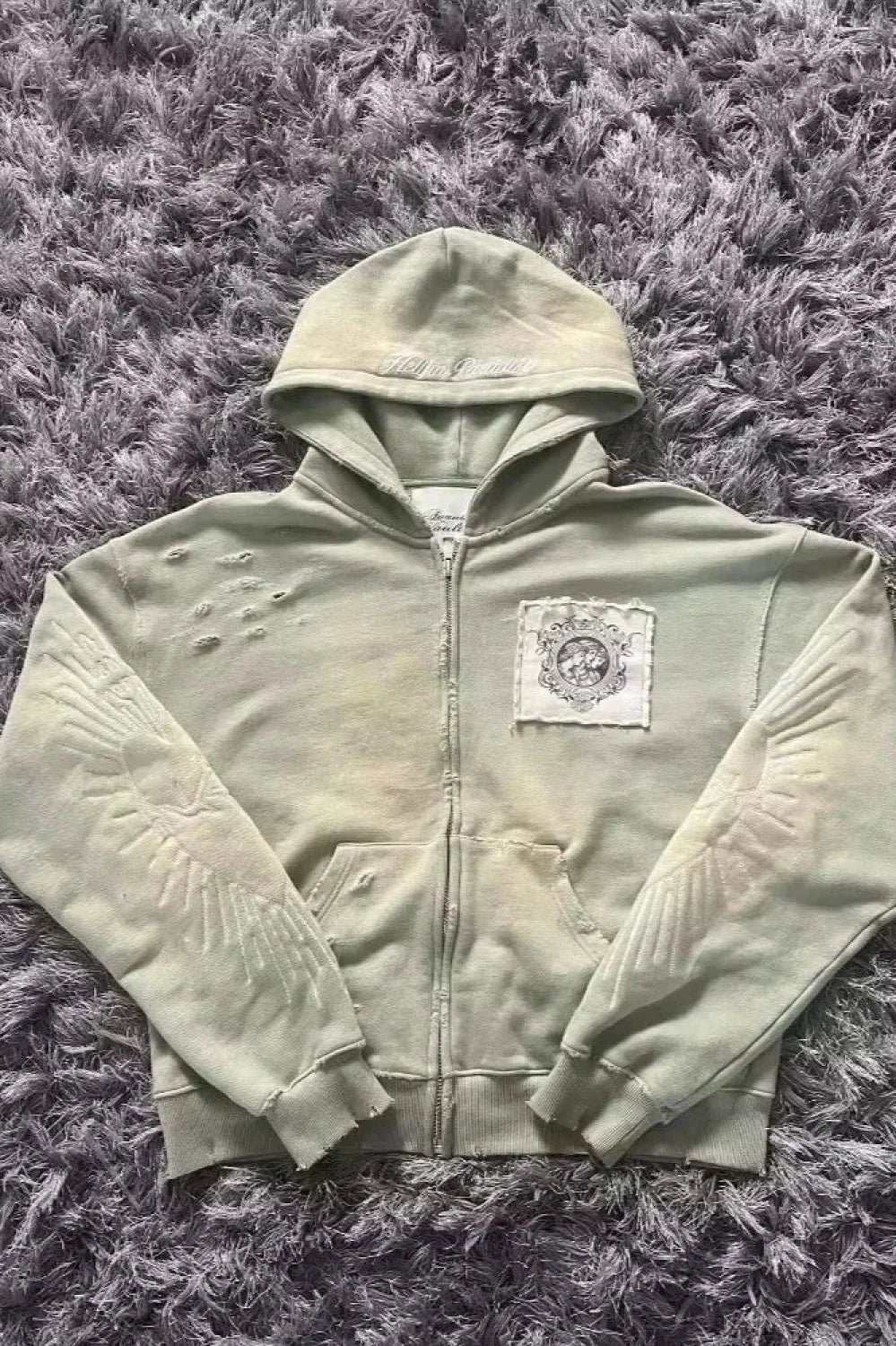 Unisex padded zip hoodie with attached hood and long sleeves