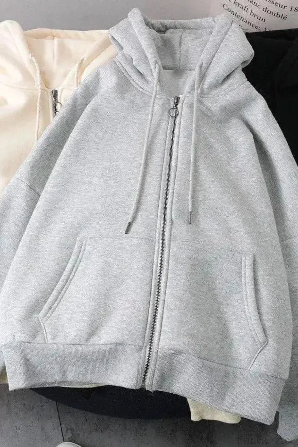 Unisex padded zip hoodie with attached hood and long sleeves