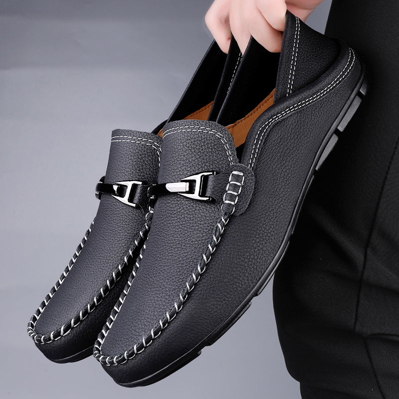 Slip-on loafers with moc toe stitching and a polished metal bar detail