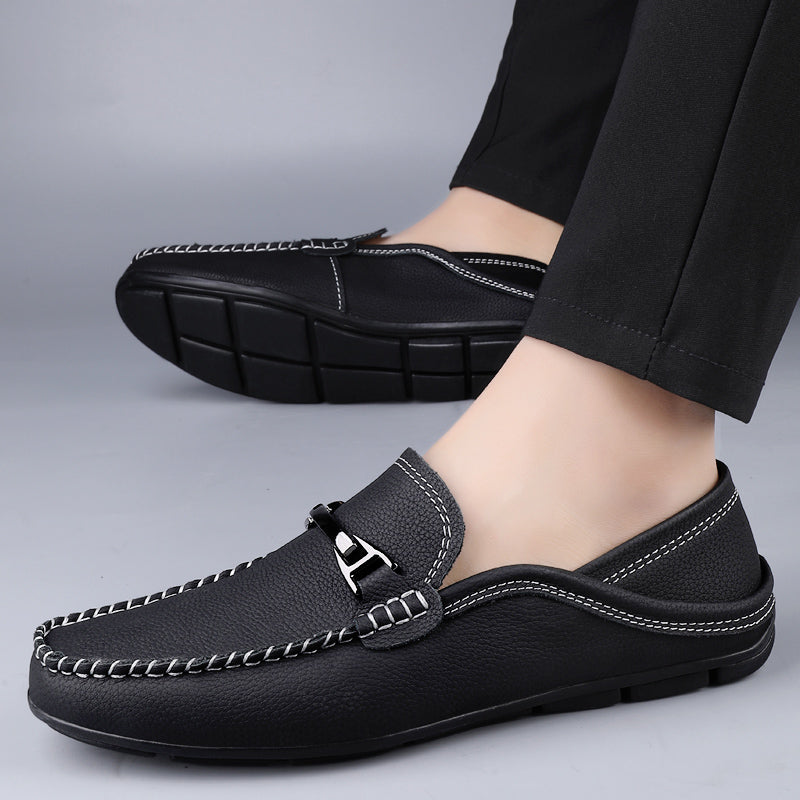 Slip-on loafers with moc toe stitching and a polished metal bar detail