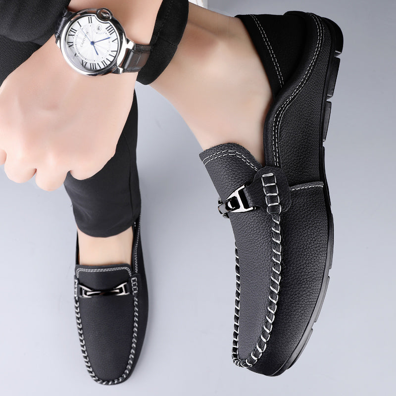 Slip-on loafers with moc toe stitching and a polished metal bar detail