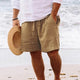 Men's relaxed fit shorts with drawstring waist, shown in tan and navy