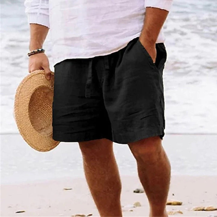 Men's relaxed fit shorts with drawstring waist, shown in tan and navy