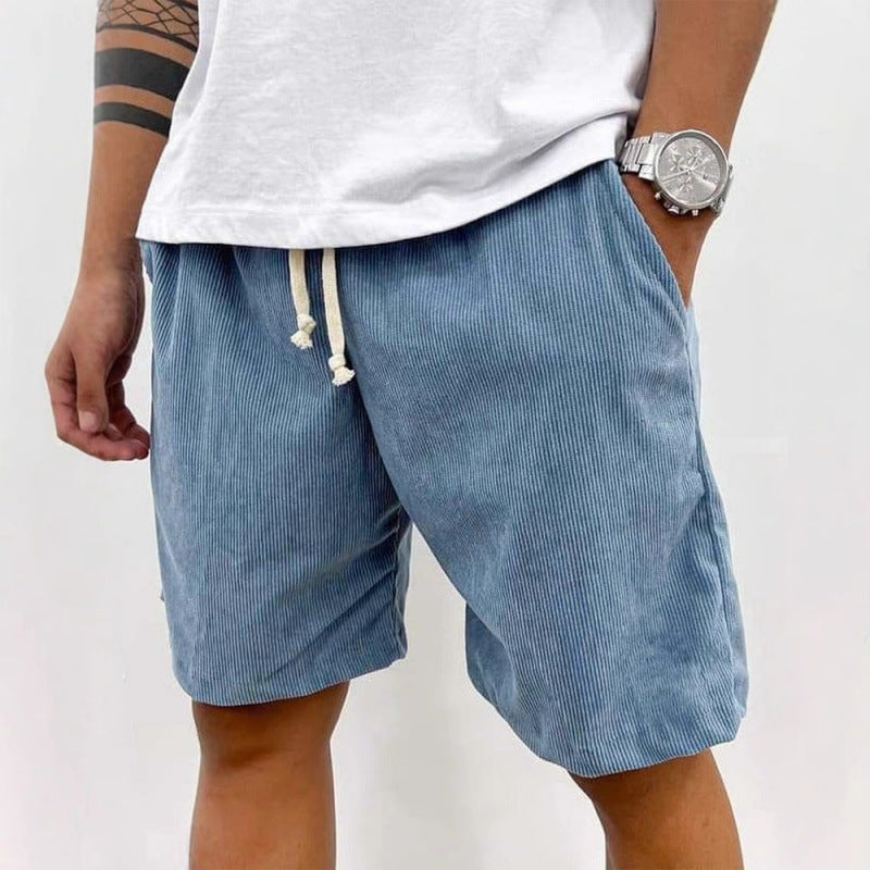 Men's relaxed fit shorts with elastic waist and drawstring, shown in green and beige