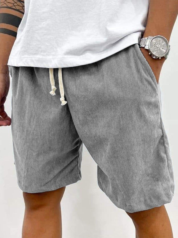 Men's casual shorts with vertical stripe texture, fitted thigh, and cream drawstring