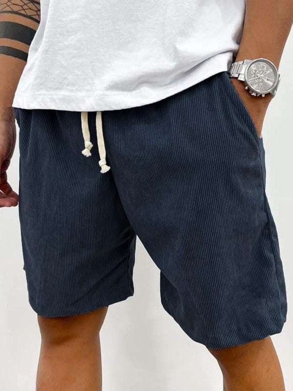 Men's casual shorts with vertical stripe texture, fitted thigh, and cream drawstring