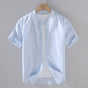 Men's beige short sleeve stand collar shirt with button front, flat lay view