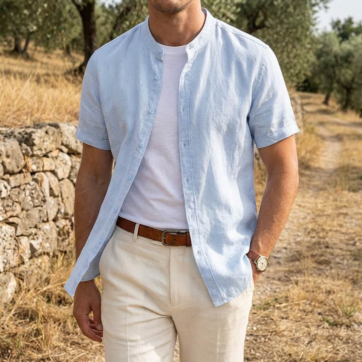 Men's beige short sleeve stand collar shirt with button front, flat lay view