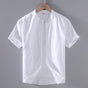 Men's beige short sleeve stand collar shirt with button front, flat lay view