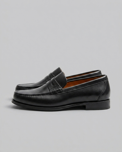 Men's slip-on loafers with moc toe stitching and penny strap detail