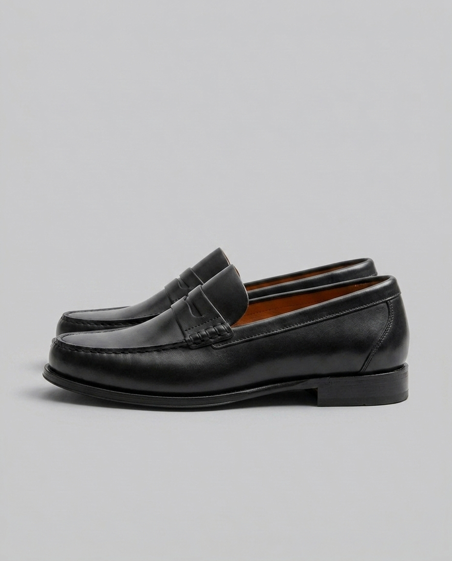 Men's slip-on loafers with moc toe stitching and penny strap detail