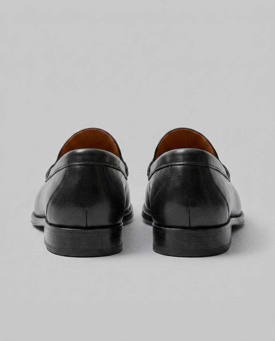 Men's slip-on loafers with moc toe stitching and penny strap detail