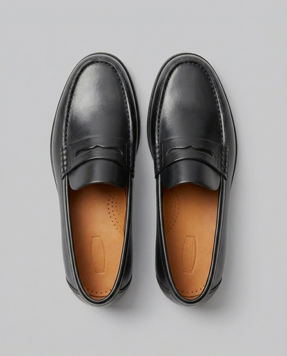 Men's slip-on loafers with moc toe stitching and penny strap detail