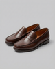 Men's slip-on loafers with moc toe stitching and penny strap detail
