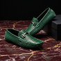 Textured loafers with metal buckle details and rounded toes