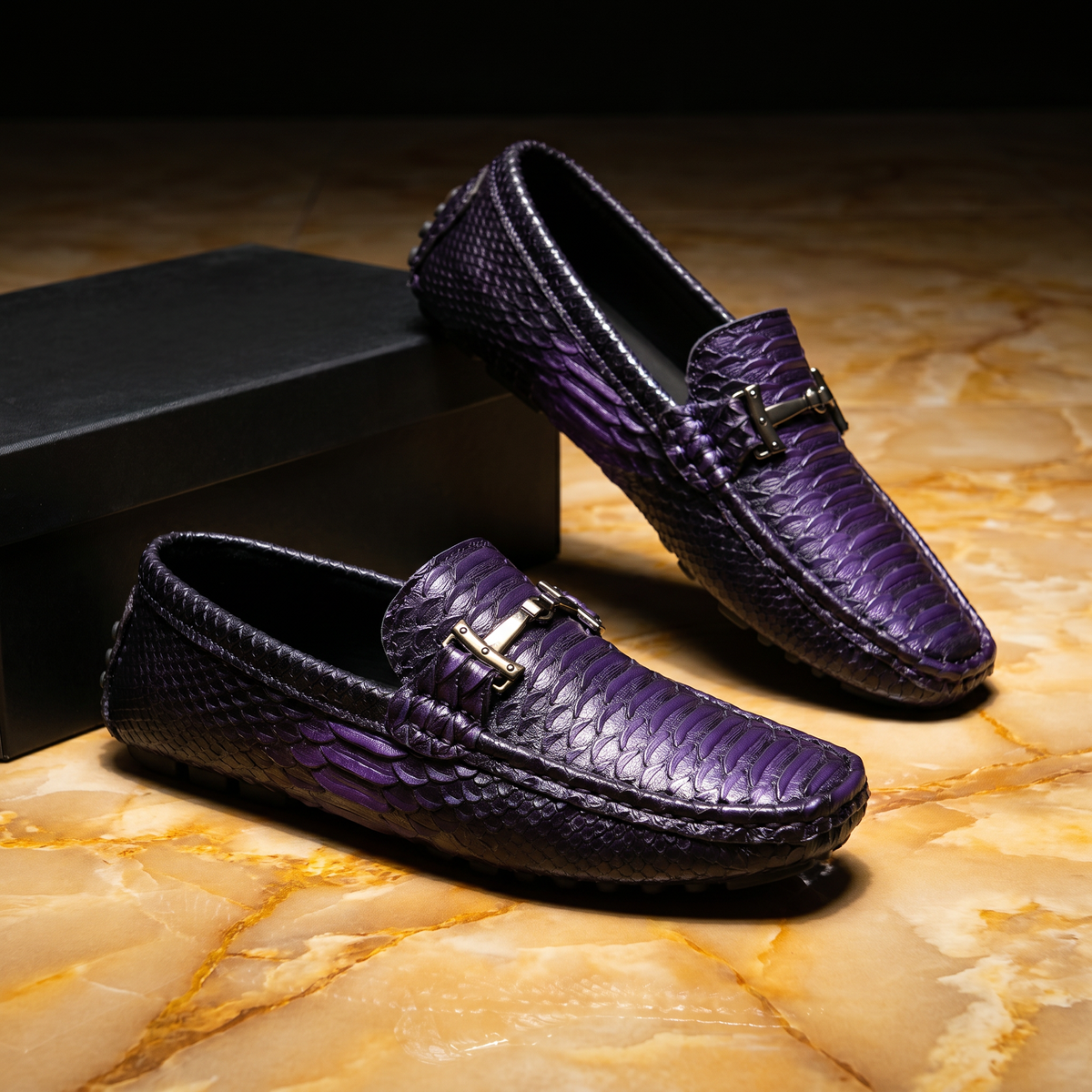 Textured loafers with metal buckle details and rounded toes