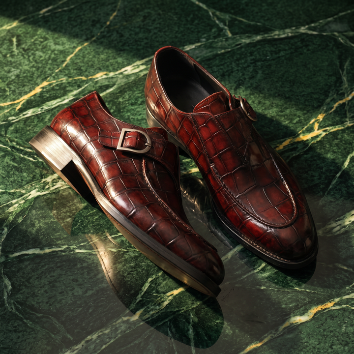 Crocodile pattern loafers with buckle straps and low heels
