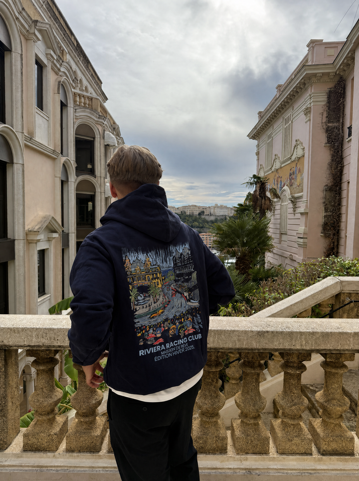 Graphic Riviera Racing Club hoodie with illustrated racing scene on the back