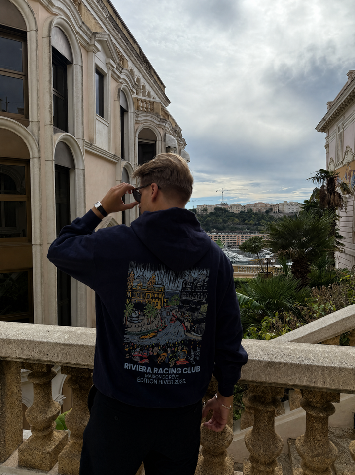 Graphic Riviera Racing Club hoodie with illustrated racing scene on the back