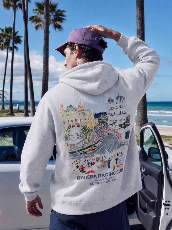 Graphic Riviera Racing Club hoodie with illustrated racing scene on the back