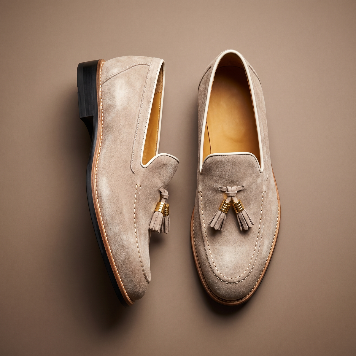 Men's slip-on loafers with tassel detail, moc toe stitching and low block heel