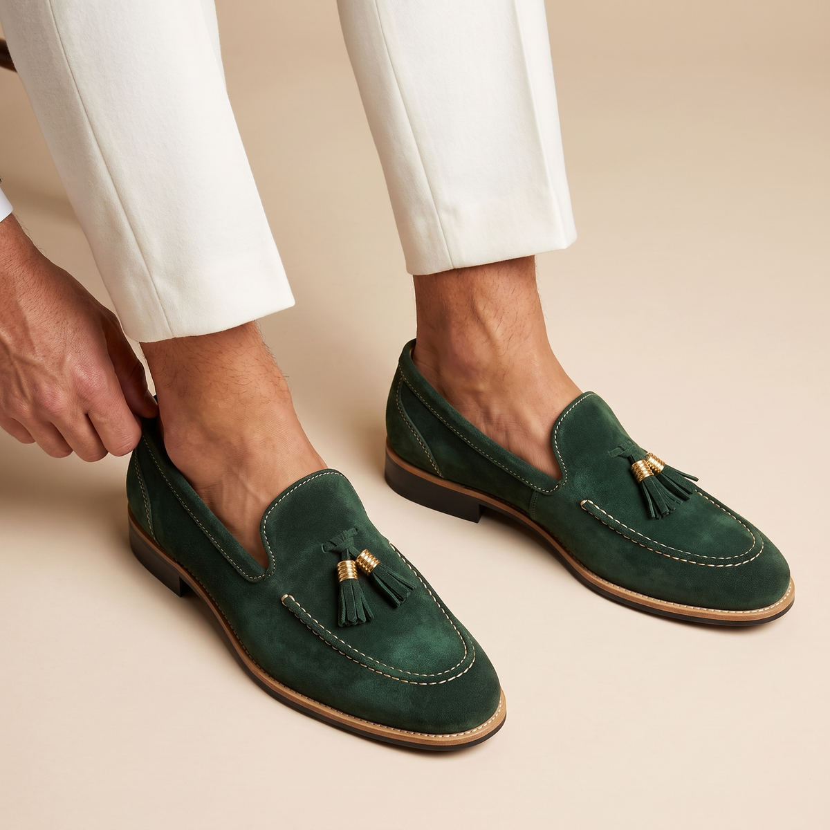 Men's slip-on loafers with tassel detail, moc toe stitching and low block heel