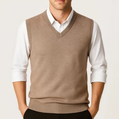 Men's sleeveless V-neck sweater vest layered over a collared shirt